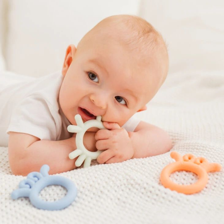 Baby chewing Baby Octopus Silicone Teether - Blue on. Pollywiggles